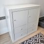 White IKEA Kallax unit, with 4 drawers and 2 doors