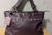 Designer Yoshi purple colour leather handbag