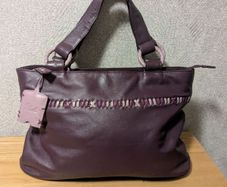 Designer Yoshi purple colour leather handbag
