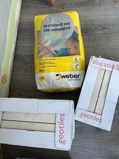 3 boxes tiles and adhesive