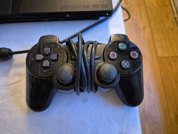 Play Station 2 super slim + DualShock 2 + Charlie game