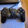 Play Station 2 super slim + DualShock 2 + Charlie game Image 2