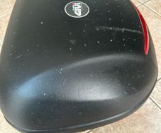 Motorcycle helmet top box