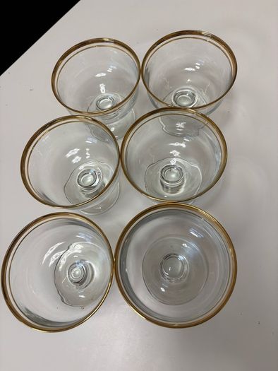 Set of six clear glass footed dessert dishes with gold-trimmed rims