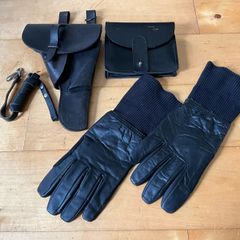 Vintage military-style black leather gear, likely representing a pistol holster, ammunition pouch