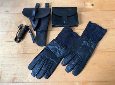 Vintage military-style black leather gear, likely representing a pistol holster, ammunition pouch