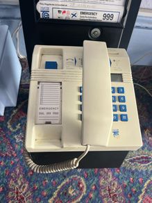 old style payphone. Phone Money vault was opened. Steel bent and open