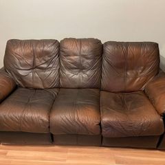 Leather reclining sofa set