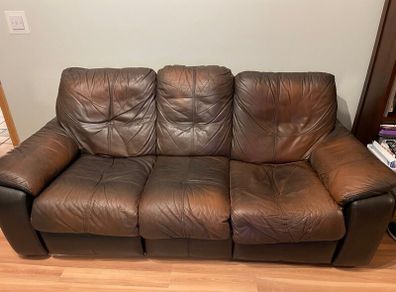 Leather reclining sofa set