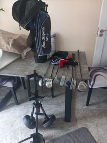 Kids golf clubs and bag and trolley.