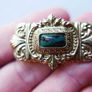 Vintage gold tone brooch with Green Faceted Stone Image 4