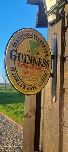 Guinness 2 sided cast iron sign