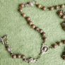 Vintage original Catholic rosary in its leather pouch Image 2