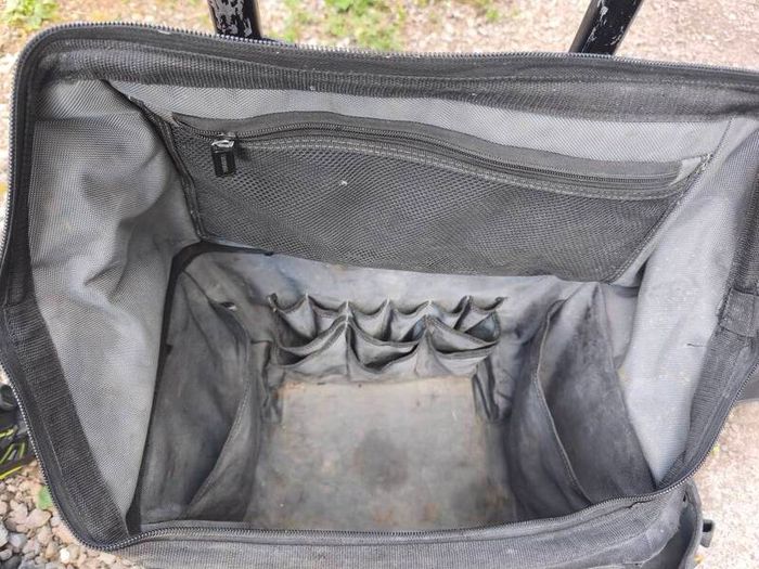tough built rolling tool bag with various pouches