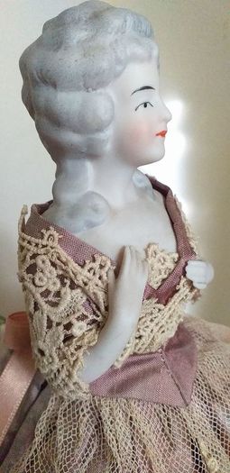 antique half pin doll with skirt