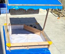 sand pit with canopy roof