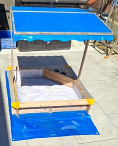 sand pit with canopy roof