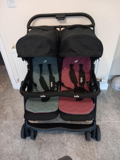Joie double baby's buggie with rain covers