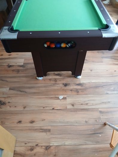 Pool table with cues and balls