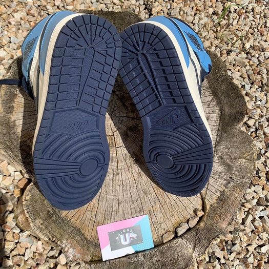 Get The 1 and Only Jordan 1 Mid Obsidian UNC