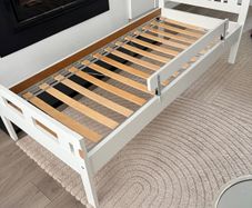 Toddler bed with guardrail