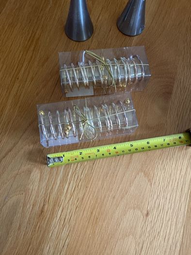 4 napkin holders (new) and 2 used candlesticks