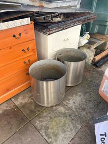 2x stainless steel flower pots on wheels