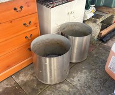 2x stainless steel flower pots on wheels