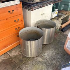 2x stainless steel flower pots on wheels