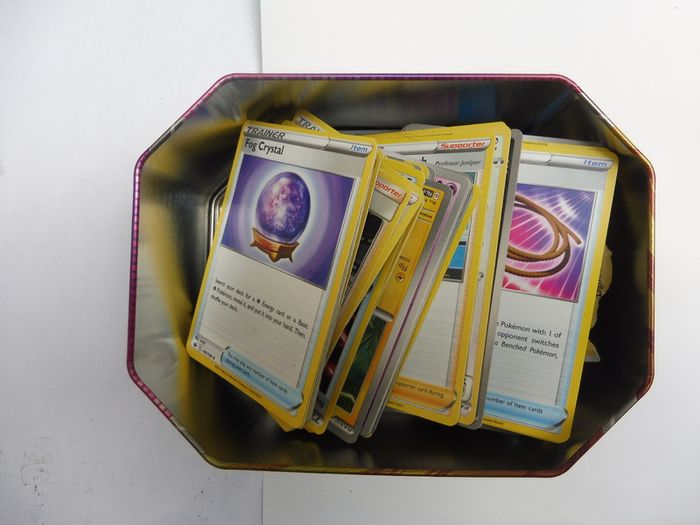Pokemon Trading Card Game Gouging Fire tin box with bulk cards