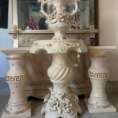 cream and gold stands ans mini table with matching vase