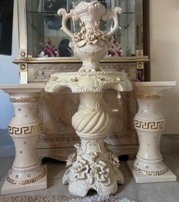 cream and gold stands ans mini table with matching vase