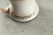 Connemara Pottery Irish stoneware mug with a cream glaze and brown rim