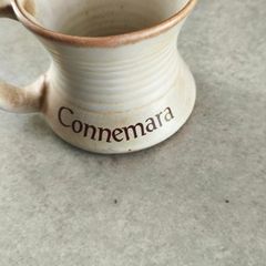Connemara Pottery Irish stoneware mug with a cream glaze and brown rim