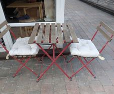 outdoor folding table and chair set including cuchions