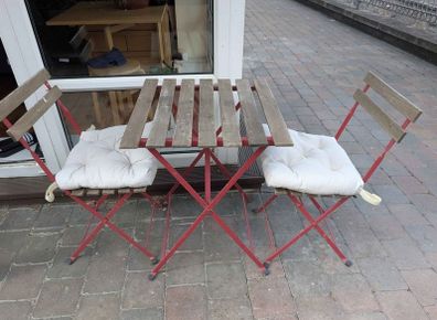 outdoor folding table and chair set including cuchions