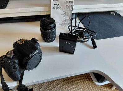 Canon 2000D with 18-55mm lens and bag