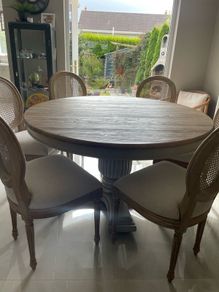Dining table round 140cm with 6 rattan back chairs