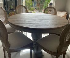 Dining table round 140cm with 6 rattan back chairs