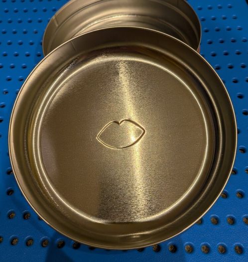 Colourful circular tin box