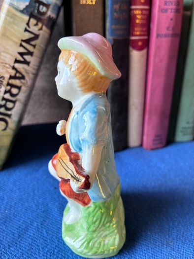 Vintage ceramic figurine of a young Boy Playing a Mandolin