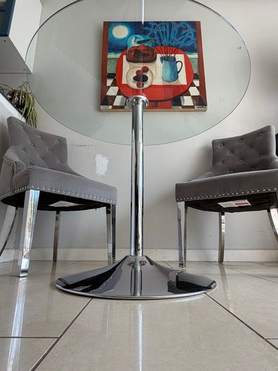 Glass table with velvet studded chairs