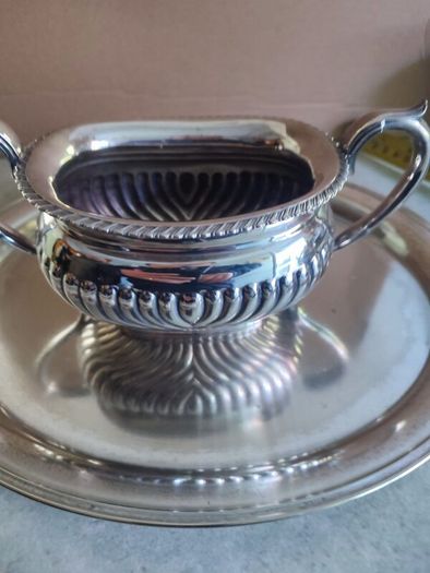 Vintage from the 19th century. Antique Period English Tea Service inc Teapot, Sugar bowl & milk jug Sheffield England on small silver plated tray.