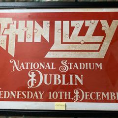 A very large framed print advertising Thin Lizzy