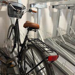Basket bicycle, with helmet and chargeable rear light,