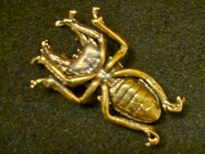 3 brass beetles.