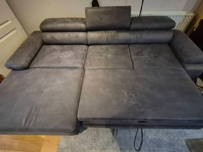 dark grey corner sofa with sleeping and storage