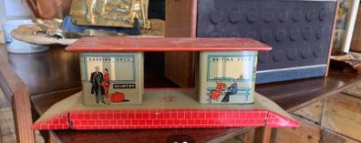 A tin plate Brimtoy painted metal model railroad station platform