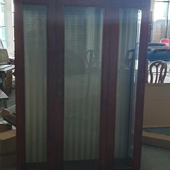 Tall antique glass display cabinet