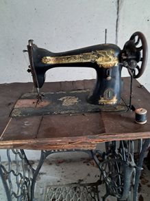 Sewing machine and base